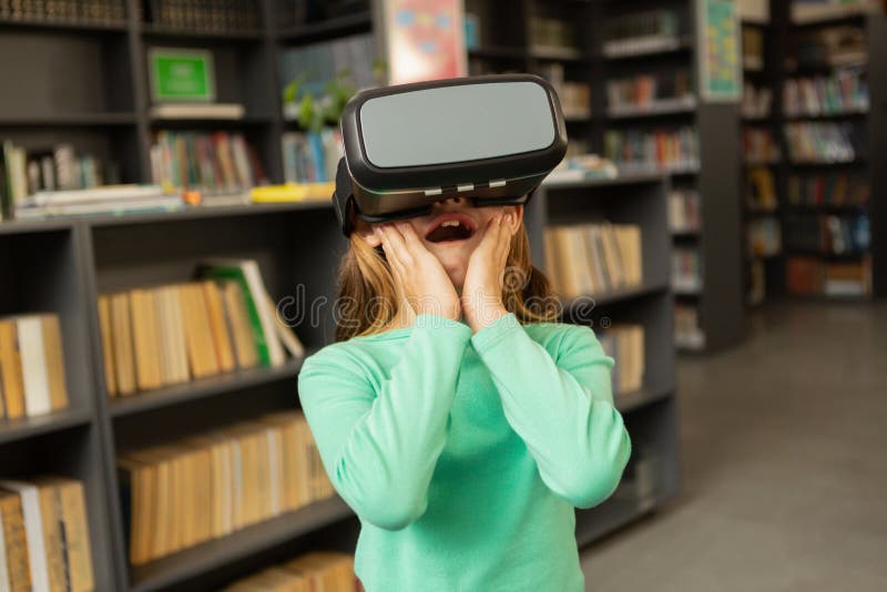 Schoolgirl Using Virtual Reality Headset in Library Stock Photo Image of happy, indoors 140581548