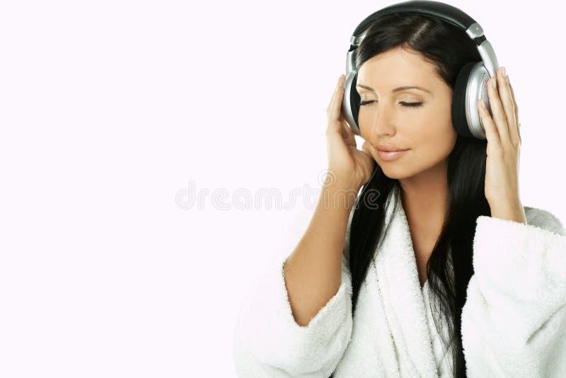 Portrait of Beautiful brunette woman listen to music with headphones. Portrait of Beautiful brunette woman listen to music with headphones