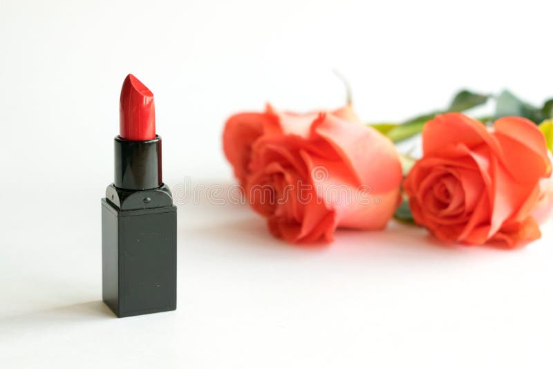 Beauty cosmetic white background with red lipstick and roses. Decorative composition with cosmetics and flowers. Makeup essentials, Cosmetic products. Feminine Modern fashion mockup, copy space. Beauty cosmetic white background with red lipstick and roses. Decorative composition with cosmetics and flowers. Makeup essentials, Cosmetic products. Feminine Modern fashion mockup, copy space