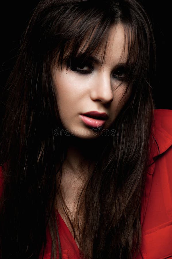 Beauty model with smoky eyes and red blouse. Beauty model with smoky eyes and red blouse