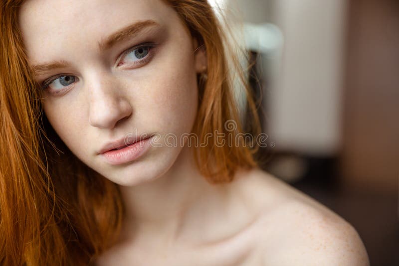 Beauty portrait of sensual thoughtful young woman with red hair looking away. Beauty portrait of sensual thoughtful young woman with red hair looking away