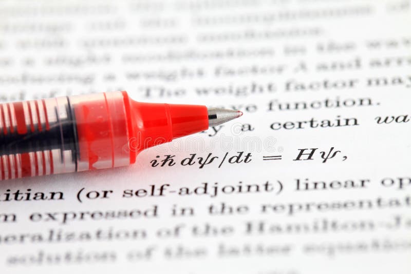 The Schrodinger equation pointed by a red pen, shallow depth of field