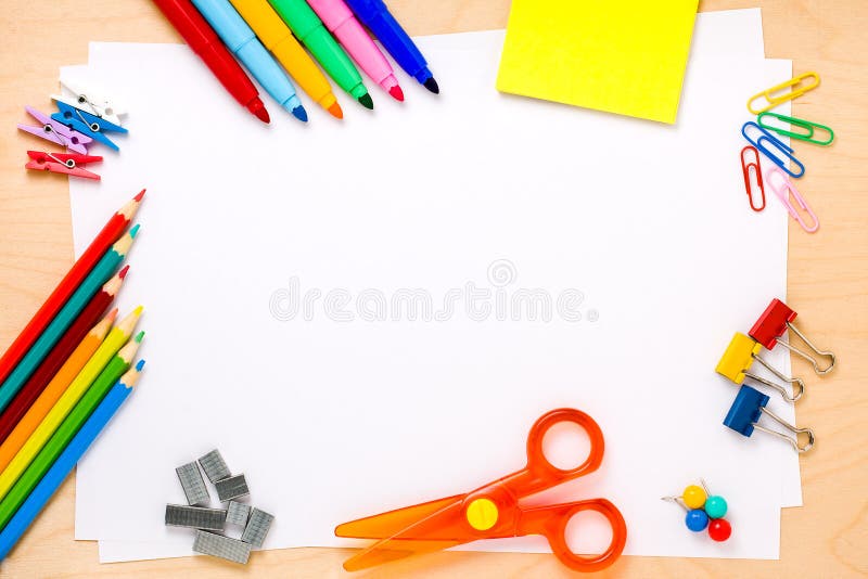 Set of crayons, scissor, colored clips, pushpins, pegs, post-its, felt-tip colored pens and other useful supplies for the school arranged to make a frame around white blank sheets ready for text writing. Set of crayons, scissor, colored clips, pushpins, pegs, post-its, felt-tip colored pens and other useful supplies for the school arranged to make a frame around white blank sheets ready for text writing