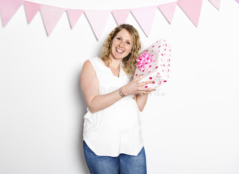 Schwangere Frau auf dem Babypartyparteifeiern stockbild Schwangere Frau auf dem Babypartyparteifeiern stockbild