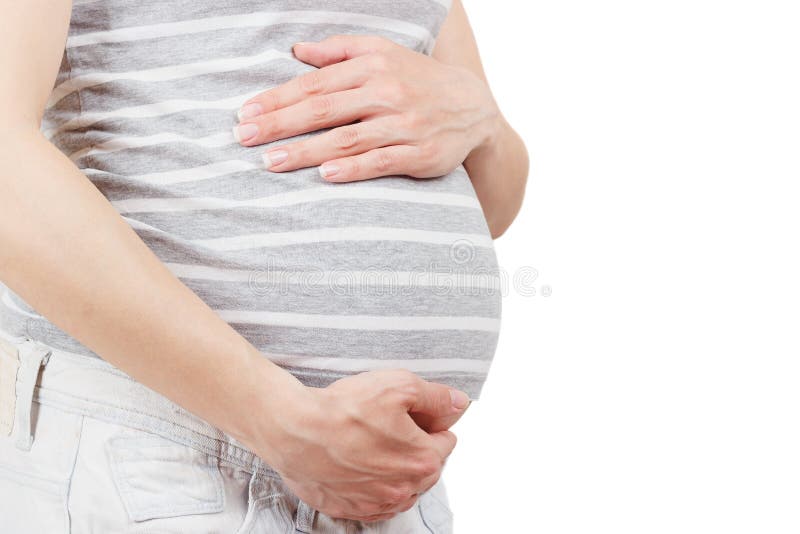 Schwangere Frau hält ihre Hände auf dem Bauch lizenzfreie stockfotos Schwangere Frau hält ihre Hände auf dem Bauch lizenzfreie stockfotos