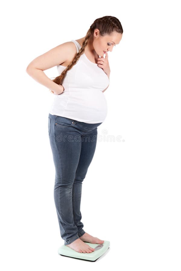 Pregnant nice woman, scales, studio, isolation. Pregnant nice woman, scales, studio, isolation