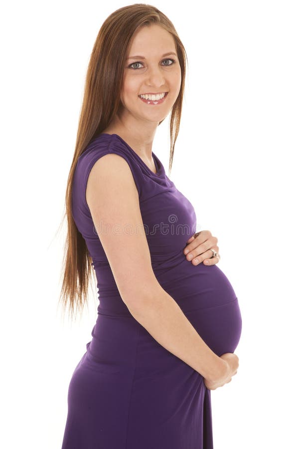 Schwangerer purpurroter Kleidergriffbauch stockfoto Schwangerer purpurroter Kleidergriffbauch stockfoto