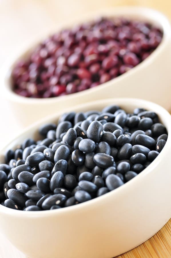 Dry black and red adzuki beans in bowls. Dry black and red adzuki beans in bowls