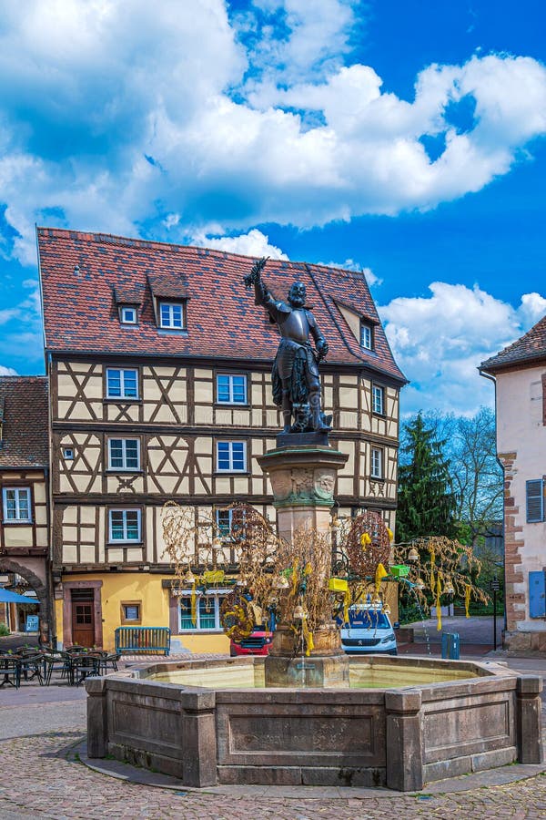 Schwendi Fountain in Place de l Ancienne Douane and traditional medieval Alsatian buildings, Colmar, France