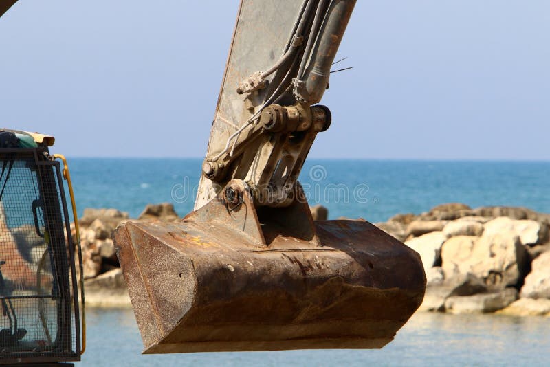 Heavy construction machinery, tractors and bulldozers at a construction site in Israel. Heavy construction machinery, tractors and bulldozers at a construction site in Israel