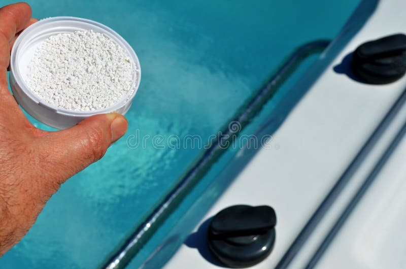 Bromine chemical being added to hot tub spa. Bromine chemical being added to hot tub spa