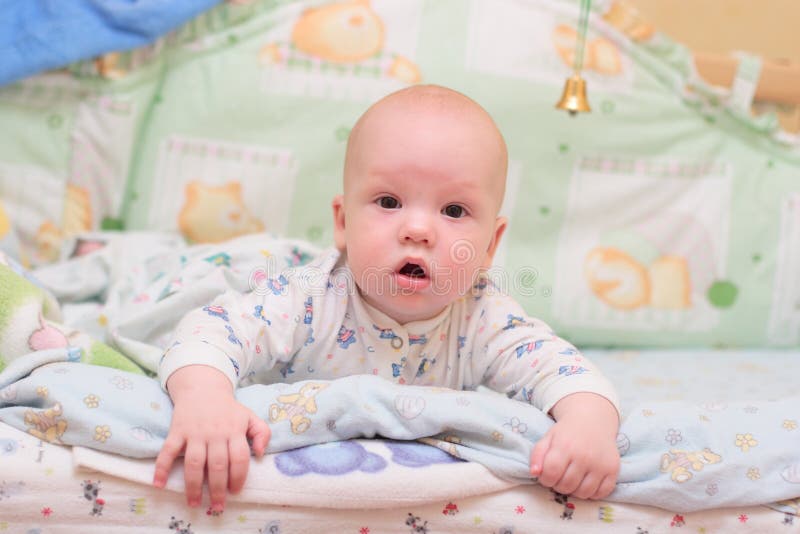 Baby rest on bed and look at camera #1. Baby rest on bed and look at camera #1