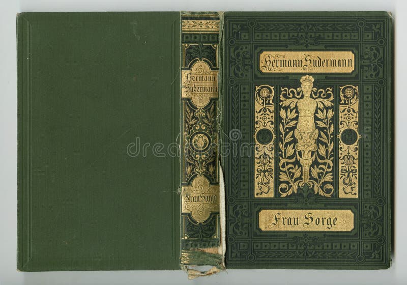 Old and ornate book cover from 1880. Old green gold leather texture with gold decorative frame. Matching texture without frame also available. isolated on grey background. Old and ornate book cover from 1880. Old green gold leather texture with gold decorative frame. Matching texture without frame also available. isolated on grey background.