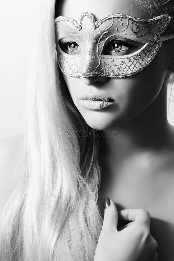 Beautiful Blond Woman in Carnival Mask.Masquerade. Girl. Beauty & Fashion. Black & White. Beautiful Blond Woman in Carnival Mask.Masquerade. Girl. Beauty & Fashion. Black & White