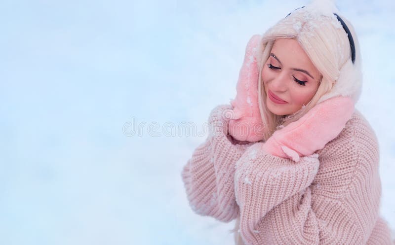 Beautiful blonde enjoys the snow. Christmas mood. Copy space. Beautiful blonde enjoys the snow. Christmas mood. Copy space.