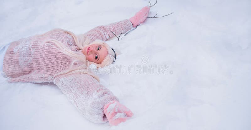 Beautiful blonde enjoys the snow. Christmas mood. Copy space. Beautiful blonde enjoys the snow. Christmas mood. Copy space.