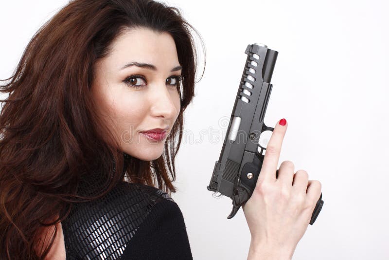 Schöne Frau mit Pistole stockbild Schöne Frau mit Pistole stockbild