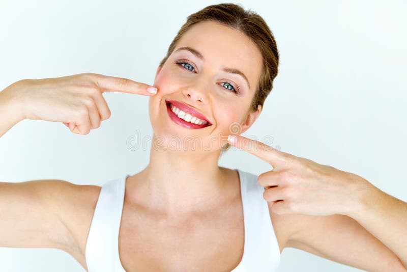 Portrait of beautiful young woman with perfect smile. Isolated on white. Portrait of beautiful young woman with perfect smile. Isolated on white.