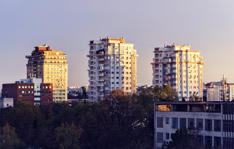 Beautiful sunset in Chisinau town. Warm light reflecting on buildings. Purple blue sky on background. Negative copy space, place for text. Moldova beauties. Beautiful sunset in Chisinau town. Warm light reflecting on buildings. Purple blue sky on background. Negative copy space, place for text. Moldova beauties