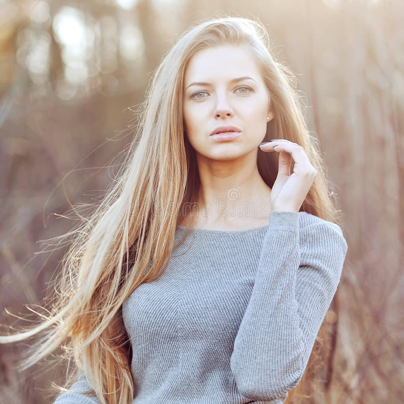 Beautiful young blond woman outdoor portrait. Beautiful young blond woman outdoor portrait