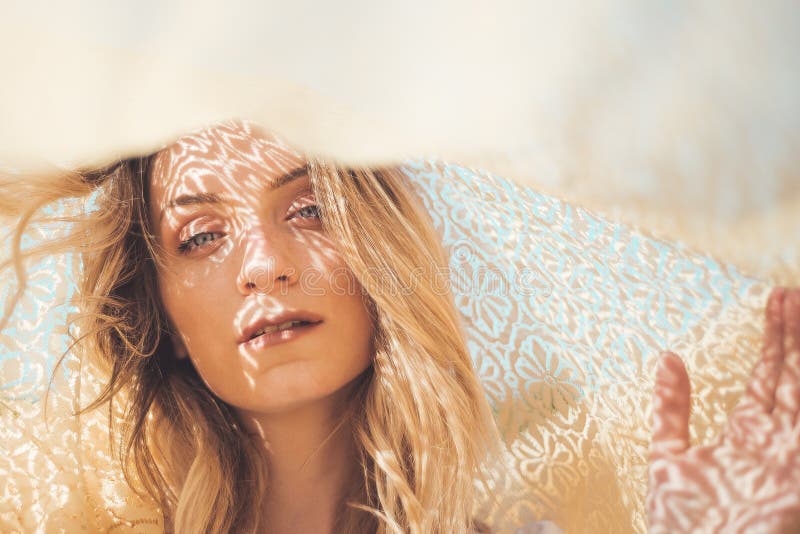 Beautiful young woman portrait under silk. Beautiful young woman portrait under silk.