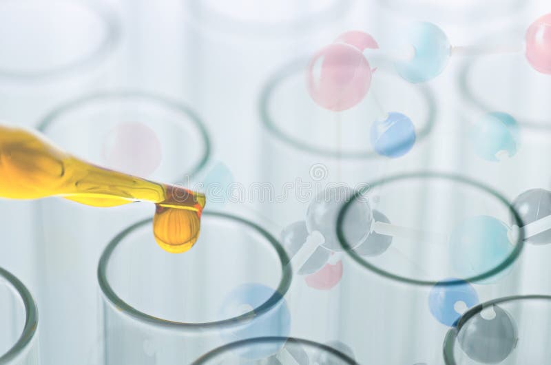 Science laboratory pipette with drop on test tube background , l stock photos Science laboratory pipette with drop on test tube background , l stock photos