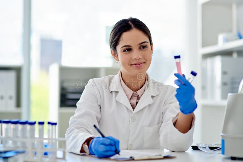 Science, woman and lab with test tube for thinking, scientist and microbiologist with research and vaccine study. Career royalty free stock photo