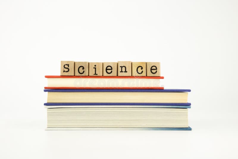Science word on wood stamps and books stock photos