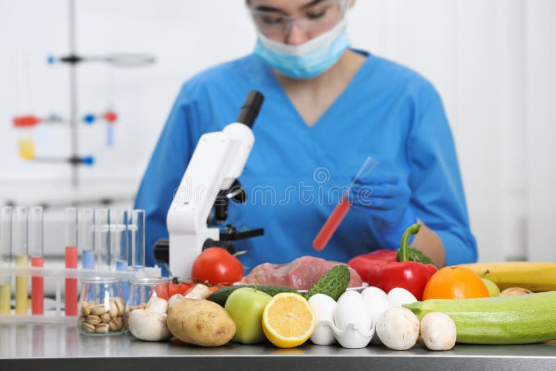 Scientist Checking Products at Table in Laboratory. Quality Control