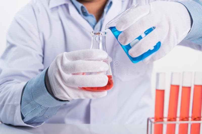 scientist drop cemical into laboratory test tube on working table, science research concept royalty free stock images scientist drop cemical into laboratory test tube on working table, science research concept royalty free stock images