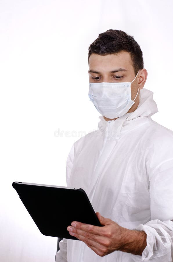 Scientist holding and looking at tablet computer