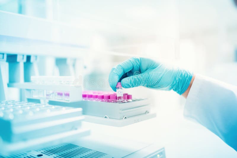 Scientist holding sample of experiment in pharmaceutical environment. close up of medical details royalty free stock photo Scientist holding sample of experiment in pharmaceutical environment. close up of medical details royalty free stock photo
