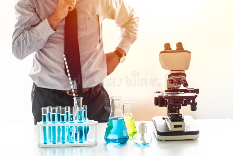 Scientist thinking to research and development in chemical lab stock photography Scientist thinking to research and development in chemical lab stock photography