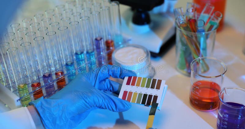 Scientist uses color palette comparing patterns on paper stock video