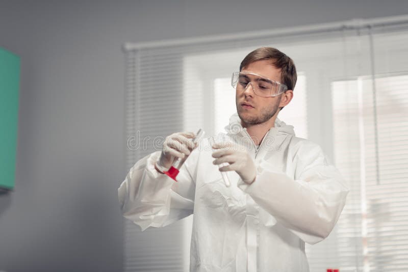 A scientist working with some samples in laboratory, doing lab tests.