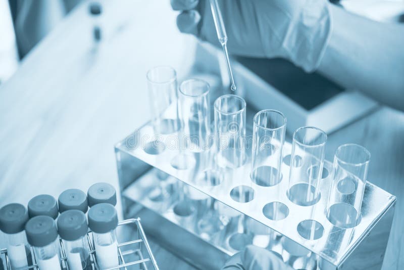 Scientists are Dripping Liquid into the Test Tube.Research in Lab Concepts. Stock Image Image
