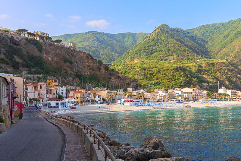View of Scilla beach, a little fishermen village with beautiful water and mountains surrounding the town in Calabria Italy royalty free stock photography View of Scilla beach, a little fishermen village with beautiful water and mountains surrounding the town in Calabria Italy royalty free stock photography