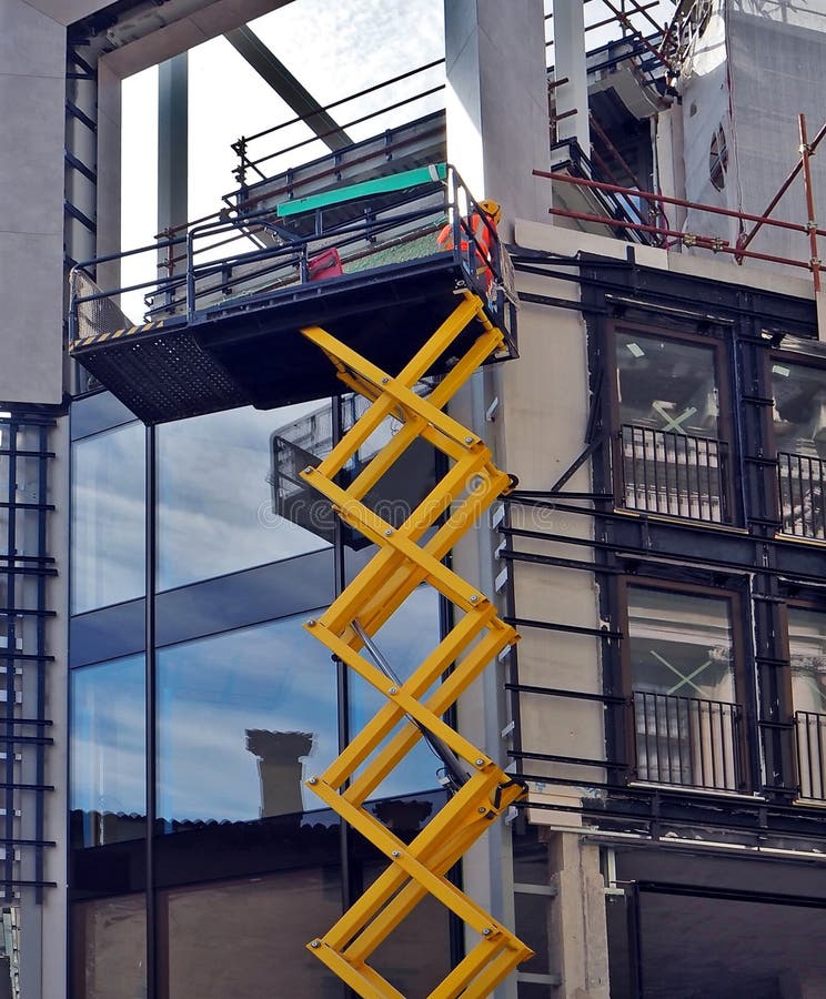 Scissor Lift, at Work on a Building Facade Under Construction Stock Image Image of technology