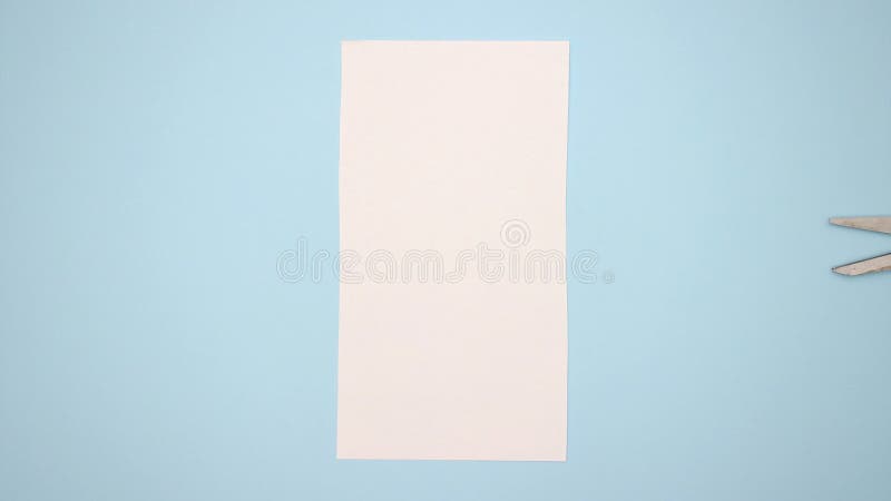Scissors cut the paper on blue background - Stop motion animation royalty free illustration