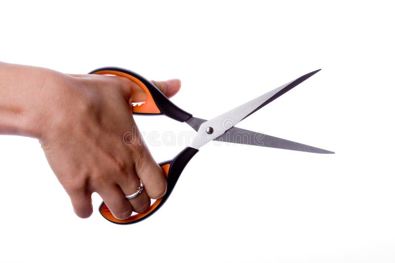 Scissors in hand stock photography