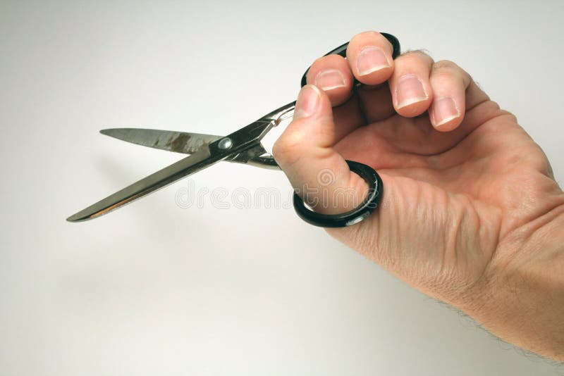 Scissors in man s hand