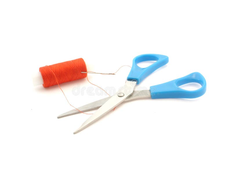 Scissors, needle and thread on white background