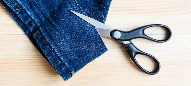 Scissors Cut Denim. Old Jeans. Repair And Sewing Of Clothes Stock Photo ...