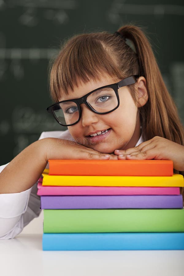 Scolara con i libri fotografie stock libere da diritti