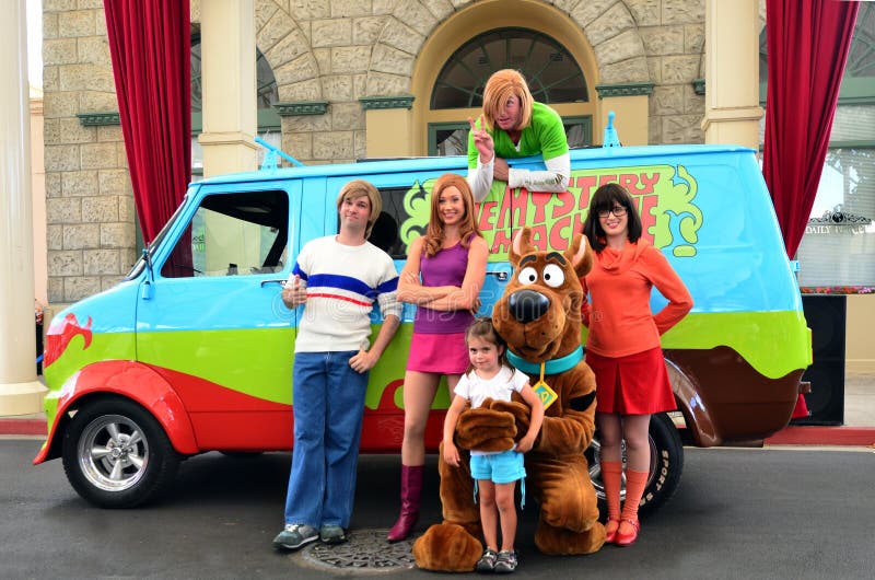 GOLD COAST, AUS - NOV 06 2014:Little girl (Talya Ben-Ari age 04) with Scooby-Doo team Movie World Gold Coast Australia.The film was a successful release with box office gross of over US$130 million.