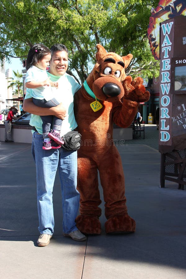 Los Angeles, California, USA - March 12, 2015: The character Scooby from Scooby-Doo movie is greeting tourists at Universal Studios Hollywood, which is the first film studio and theme park of Universal Studios Theme Parks across the world. Los Angeles, California, USA - March 12, 2015: The character Scooby from Scooby-Doo movie is greeting tourists at Universal Studios Hollywood, which is the first film studio and theme park of Universal Studios Theme Parks across the world.