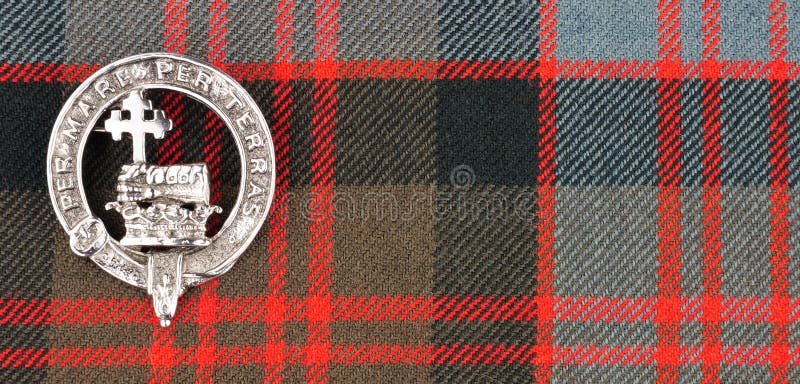 Scottish MacDonald Clan Family Crest On Tartan Fabric Background