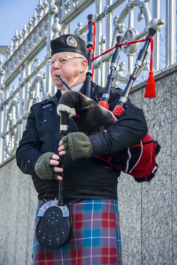 black bagpipe player image black bagpipe player image