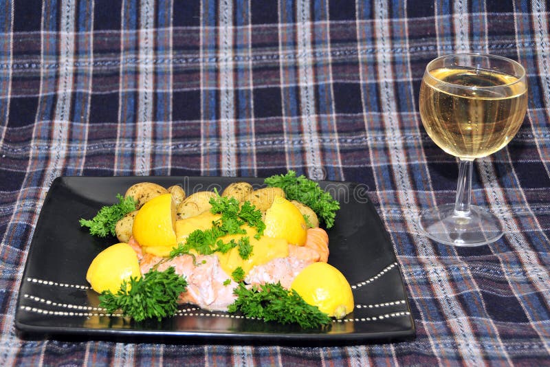 Scottish salmon and new potatoes on a Tartan background.