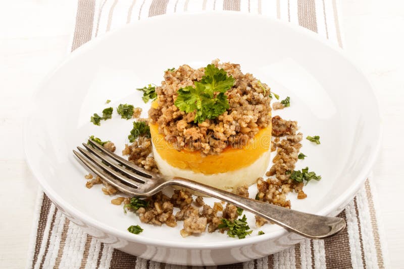 Scottish White Pudding with Mashed Potato and Turnip on a Plate Stock